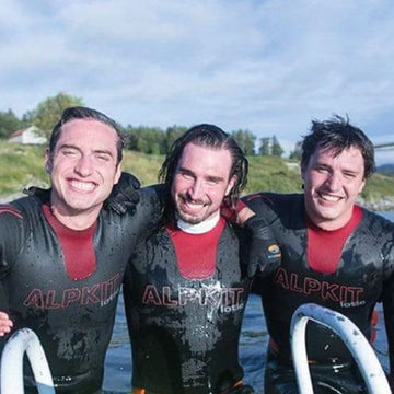 Two swimmers enter the water to go wild swimming