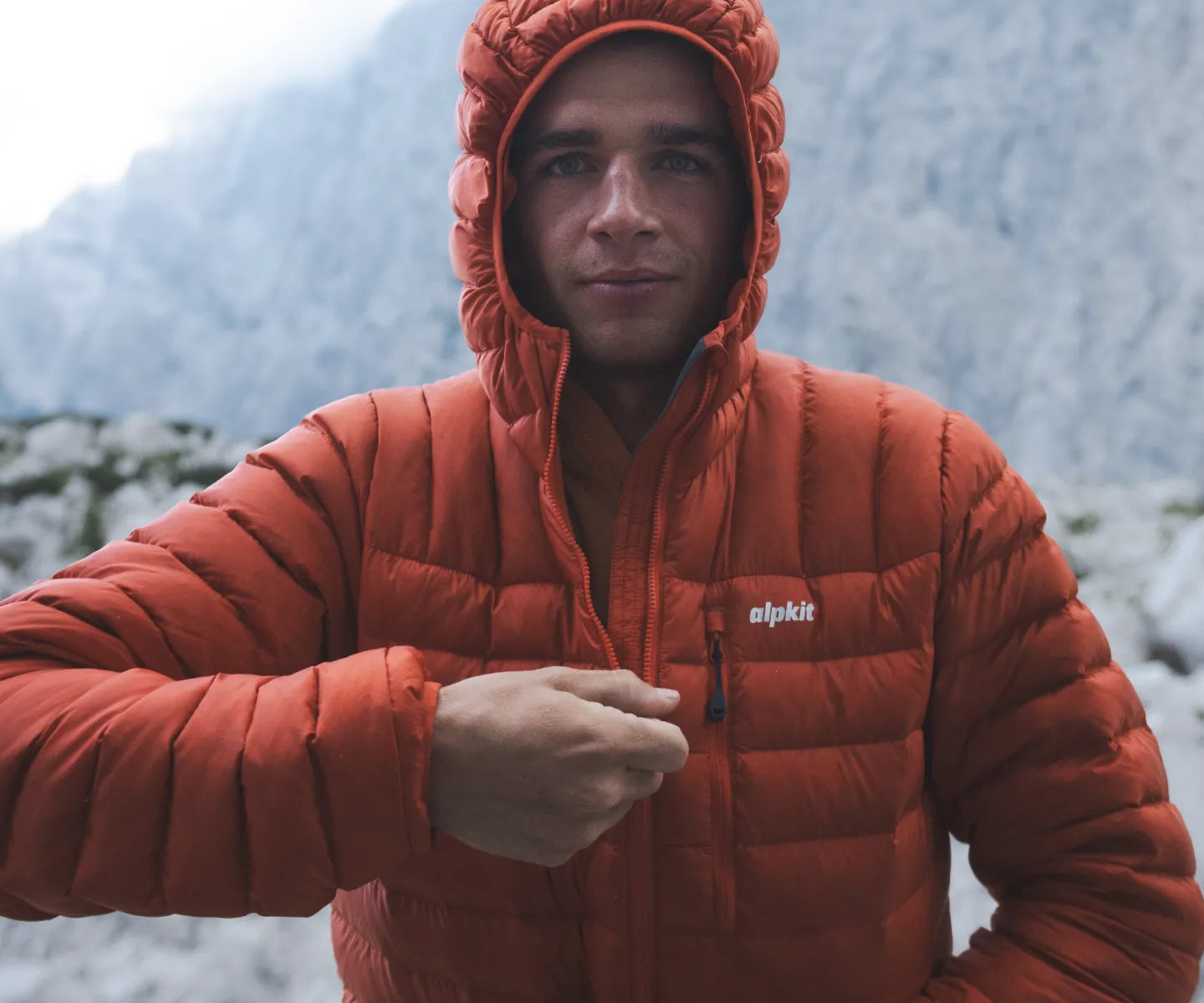 Climber wearing down jacket
