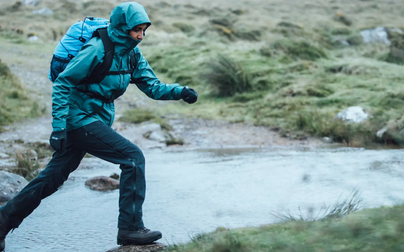 Hillwalker crossing a stream