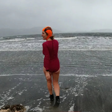 Two swimmers enter the water to go wild swimming