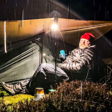 Camping gas canister attached to a camping stove