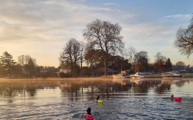Outdoors swimming with floats in the river Thames