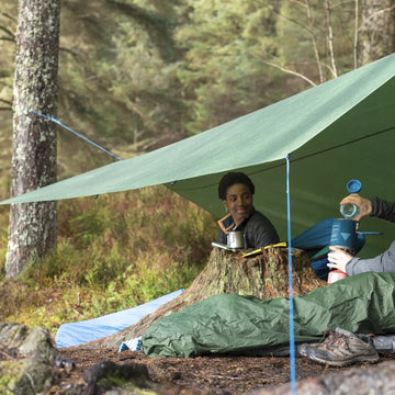 Wild camping by a lake in the mountains